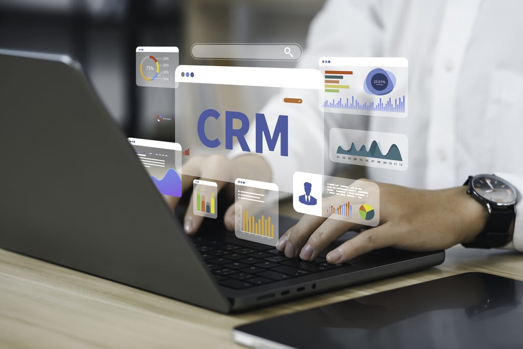 Businessman using a computer and dashboard CRM for Management Customer Relationship Management