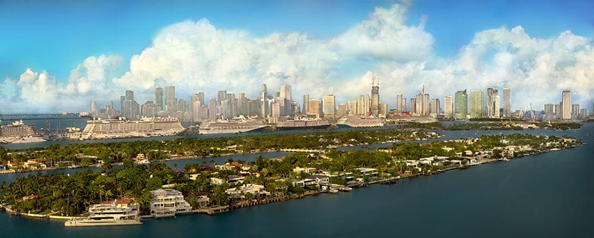Vibrant teal and orange Miami skyline panorama, commercial-grade architectural drone photography highlighting the city's modern verticality and aspirational lifestyle.
